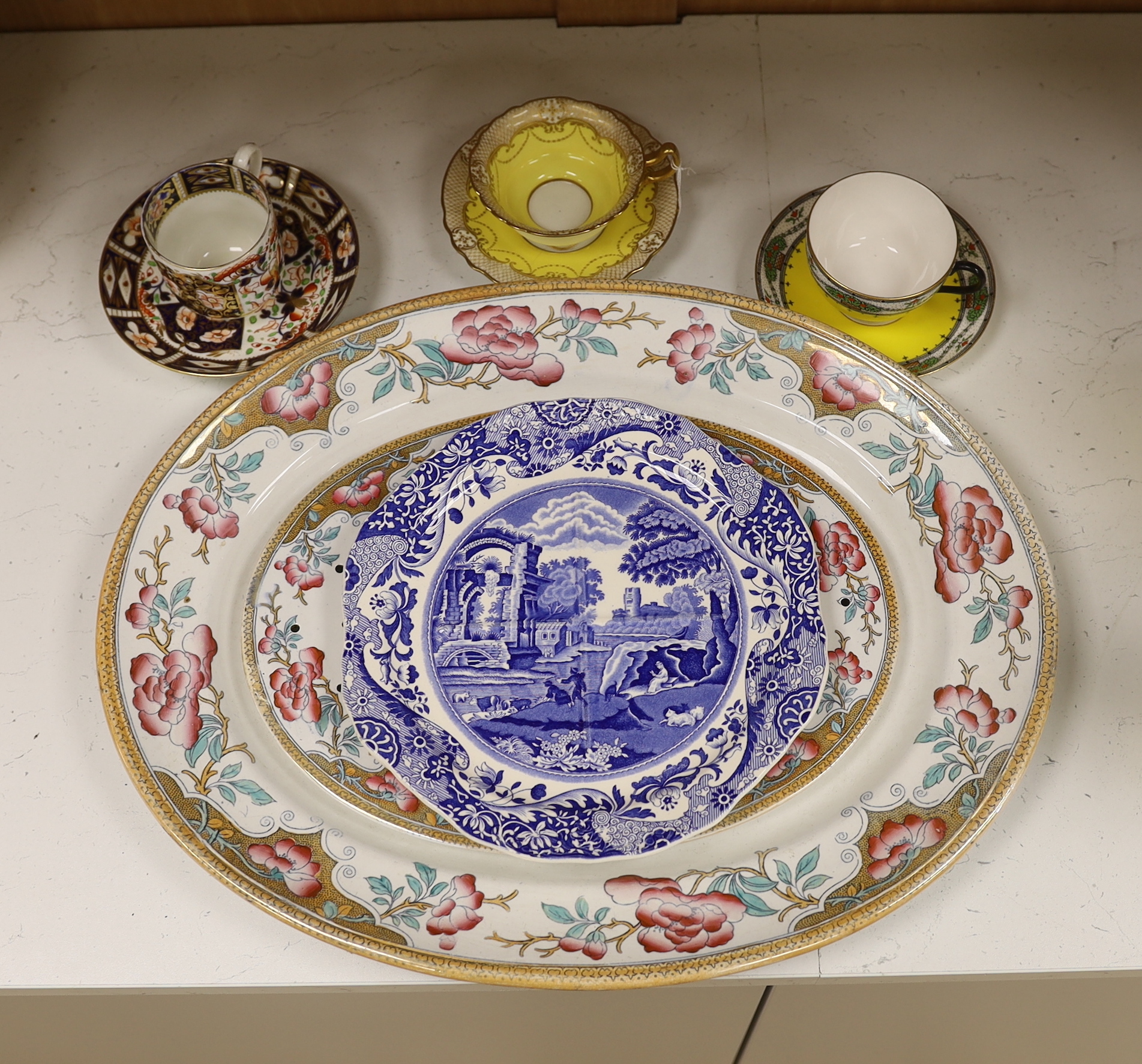 A Victorian stone china oval meat platter, a Derby cup and saucer, two others and two Spode ‘Italian’ plates, platter 50cm wide